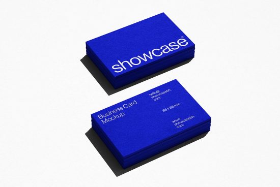Stack of blue business cards with white text mockup on light background, design presentation tool, realistic texture, branding asset.